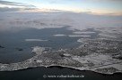 Anflug auf das verschneite Island - Reykjavík von oben